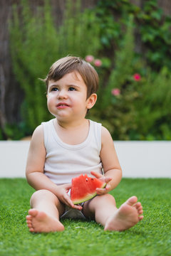 Little kid with a watermelon