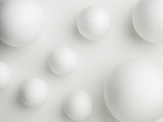 upper view of white spheres on a white background