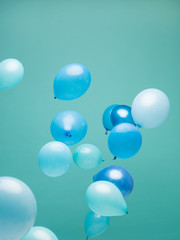 Blue balloons on blue background