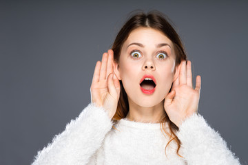 Shocked office girl eavesdropping. Hearing gesture shock emotion concept. Young nerdy stunned lady...
