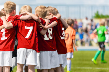 Boys Soccer Team. Children Football Academy. Kids Soccer Players in Red Shirts Standing Together on...