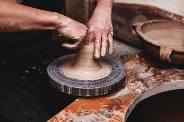 hands working with clay