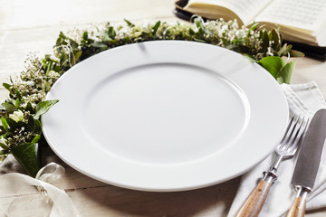 Table setting decorated with wreath