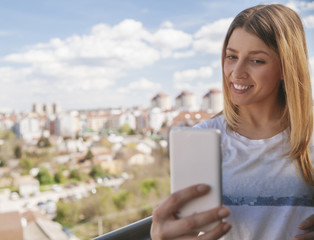 Fototapeta premium Young Woman Doing A Selfie