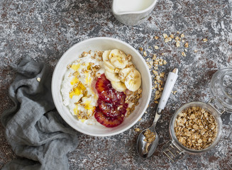 Breakfast table. Ricotta with honey, blood oranges, banana and crunchy oatmeal. Healthy food