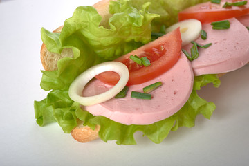 sandwich with sausage and vegetables isolated