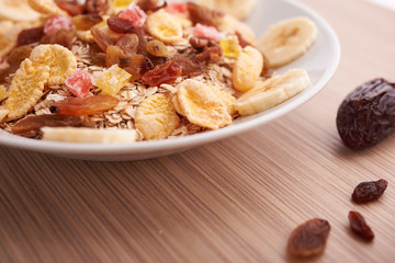 flakes with dried fruit, granola on the plate