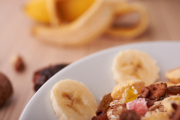 flakes with dried fruit, granola on the plate