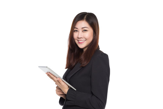 Business woman with smiling face holding tablet isolated on white background, young asian girl