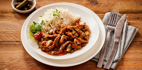 Spicy beef stroganoff with chili and gherkin