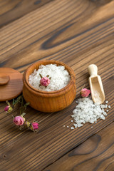 Sea salt for spa and beauty on the wooden background