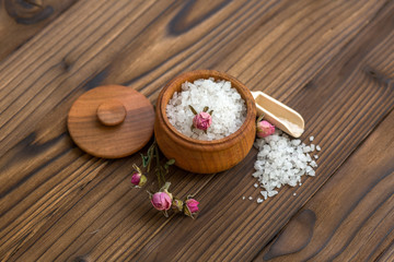 Sea salt for spa and beauty on the wooden background