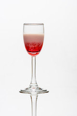 alcohol coctail singapore sling on wineglass