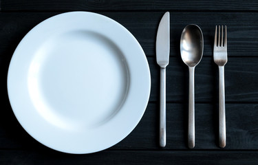 Kitchen decoration. Style. Minimalism on the crockery. Black background. Design of the kitchen