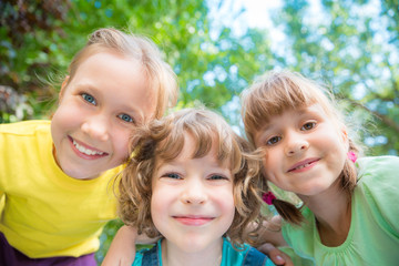 Fototapeta premium Group of happy children playing outdoors