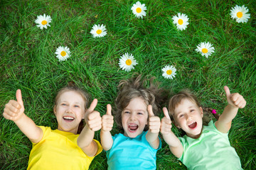 Group of happy children playing outdoors