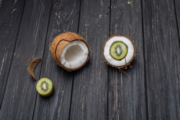 Fototapeta na wymiar Coconut and kiwi on table