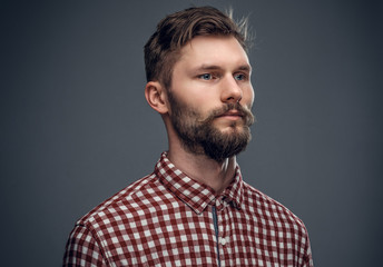 Portrait of bearded man in a red shirt.