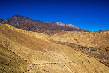 Fototapeta na wymiar Ghami village and Kali Danda, 4272m, Mustang, Nepal