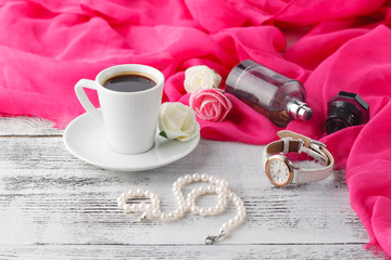 Woman relax coffee time with shawl and parfum bottle on table