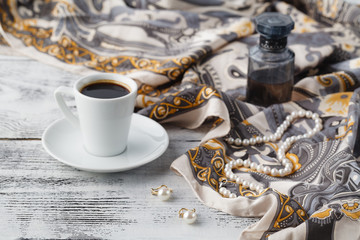 Breakfast in cafe with coffee cup and scarf on table