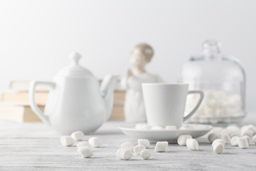 Coffee in white porcelain cup on wooden table