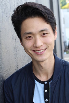 Young Asian male smiling and laughing
