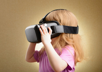 Little girl in virtual goggles