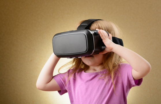 Little girl in virtual goggles