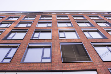 Fototapeta premium Brick building, view from the bottom