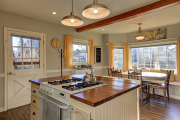 Newly renovated Kitchen and breakfast nook  with wood beams on c