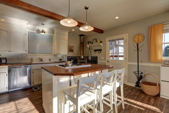 Newly renovated Kitchen boasts wood beams on ceiling