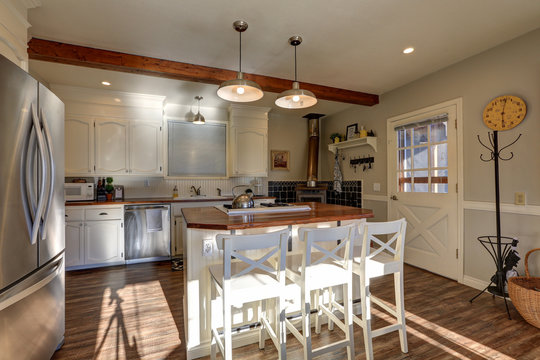 Newly renovated Kitchen boasts wood beams on ceiling