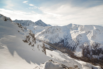 Snowy mountains in bright sunny weather. A delightful winter landscape