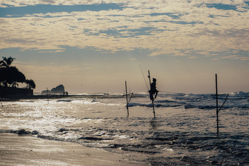 Local fisherman on stick on a beach of Indian ocean, Sri Lanka