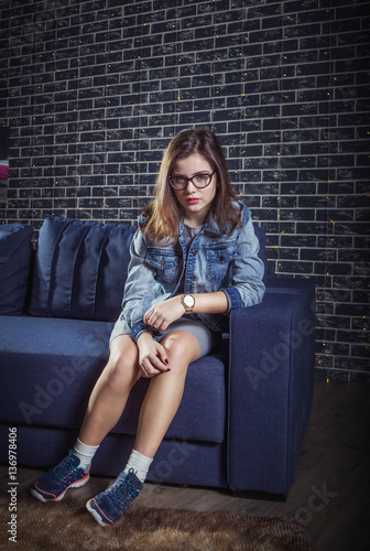 Pretty teen in sofa