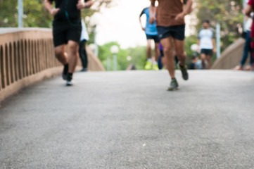 Fototapeta premium Running people on the road in blur