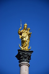 Fototapeta na wymiar Munich, Germany, Bavaria - gilded Mary statue with Christ as a child