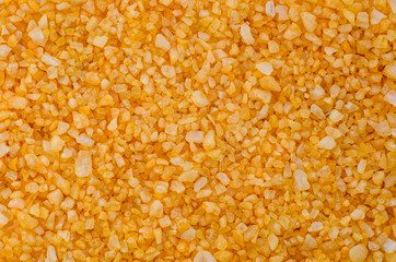 Yellow sea salt close-up background