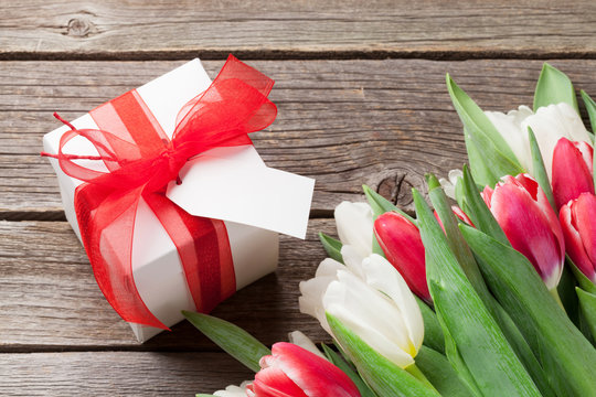 Colorful tulips and gift box