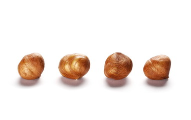 Whole hazelnuts isolated on white background