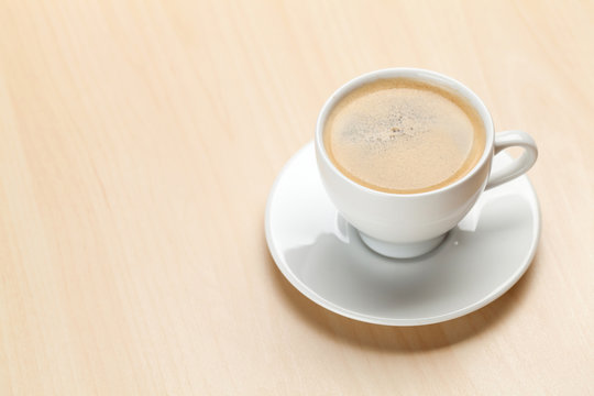 Office desk workplace with coffee cup