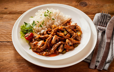 Spicy beef stroganoff served with fluffy rice