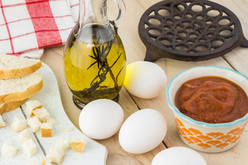 Ingredients for shirred eggs with marinara and feta.