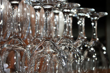 Focused wine glasses on a wooden shelf in a restaurant, Novi Sad, Serbia