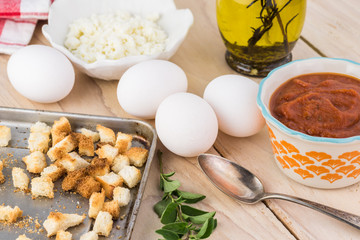 Ingredients for shirred eggs with marinara and feta.