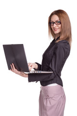 Smiling woman working on laptop wearing glasses isolated