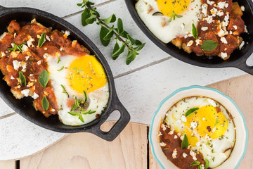 Shirred eggs with marinara and feta.