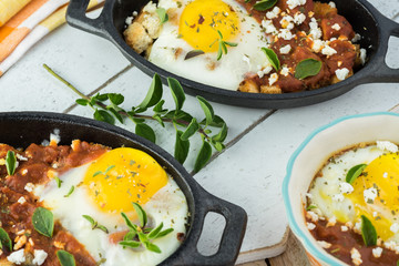 Shirred eggs with marinara and feta.