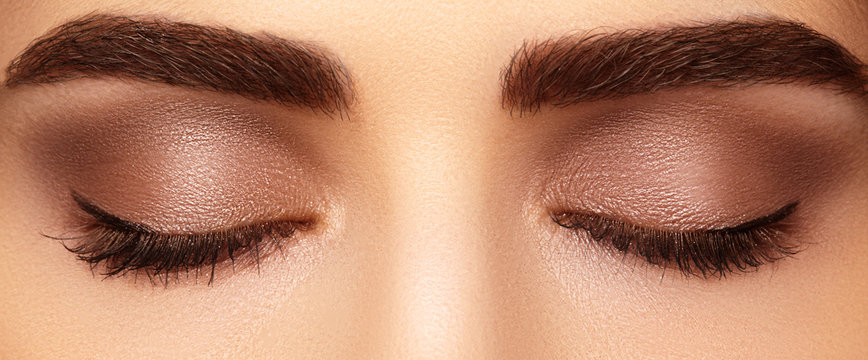 Perfect shape of eyebrows and extremly long eyelashes. Macro shot of fashion eyes visage. Before and after